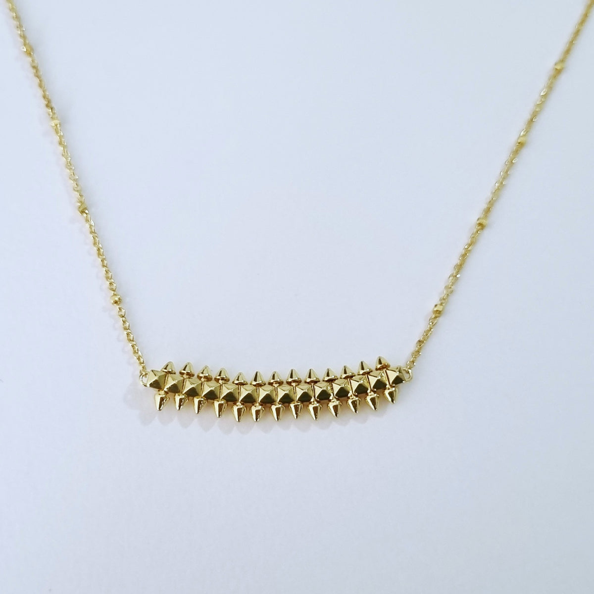 Gold plated clash pendant 18K color