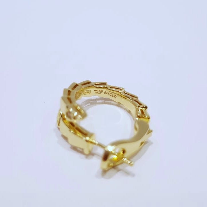 Bulgari Serpenti gold-plated hoop earrings with cubic zirconia accents, closeup view