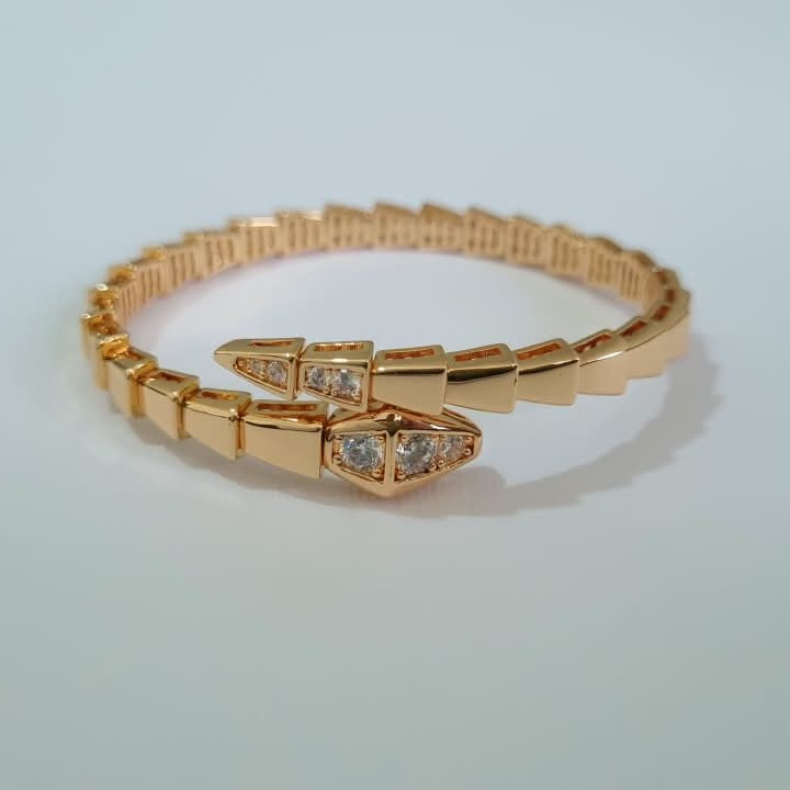 Bulgari Serpenti rose gold-plated wrap bracelet with cubic zirconia snake head detail, size 17, on white background