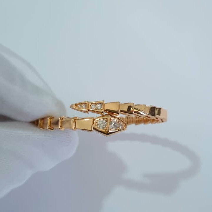 Bulgari Serpenti rose gold-plated wrap bracelet with cubic zirconia snake head detail, size 17, on white background