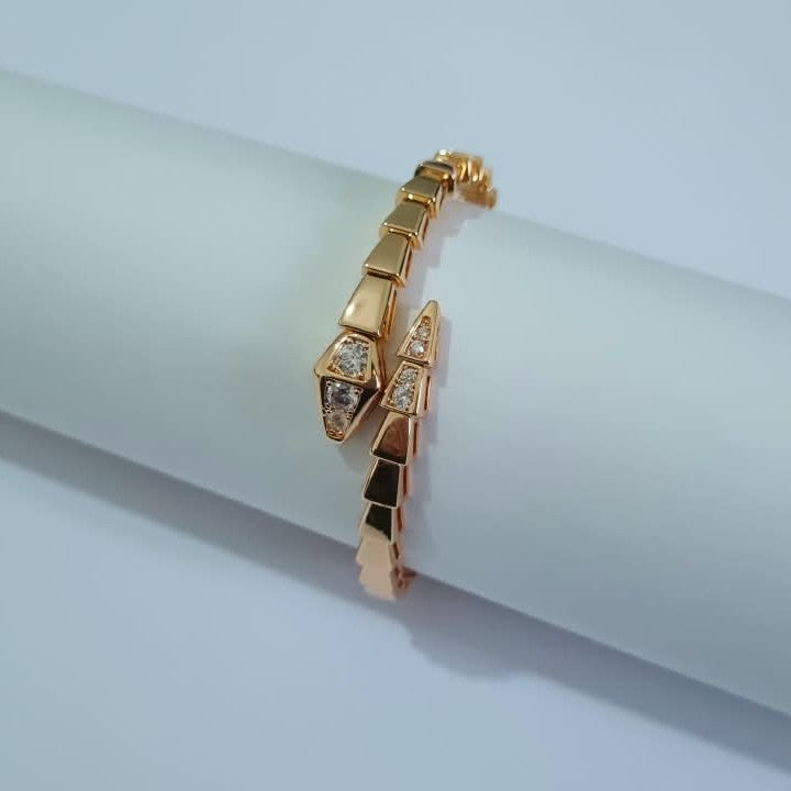 Bulgari Serpenti rose gold-plated wrap bracelet with cubic zirconia snake head detail, size 17, on white background
