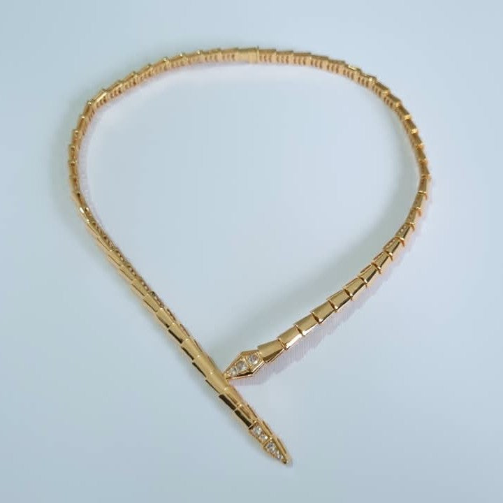 Bulgari Serpenti RoseGold-plated choker necklace with cubic zirconia snake head and tail detail, on white background