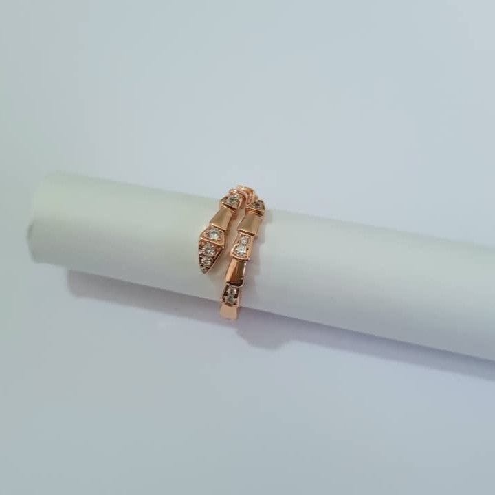 Bulgari Serpenti Rosegold-plated wrap ring with cubic zirconia snake head detail, size 7, on white background