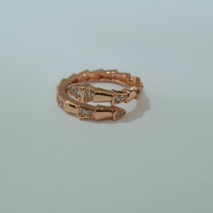 Bulgari Serpenti Rosegold-plated wrap ring with cubic zirconia snake head detail, size 7, on white background