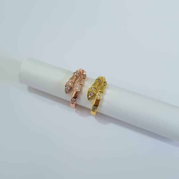 Bulgari Serpenti two colors gold and RoseGold wrap rings with cubic zirconia snake head detail, size 7, on white background