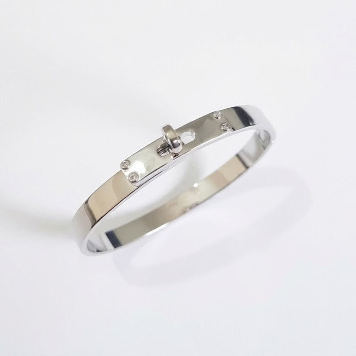 Hermes Kelly padlock bangle in Silver-plated finish on white background