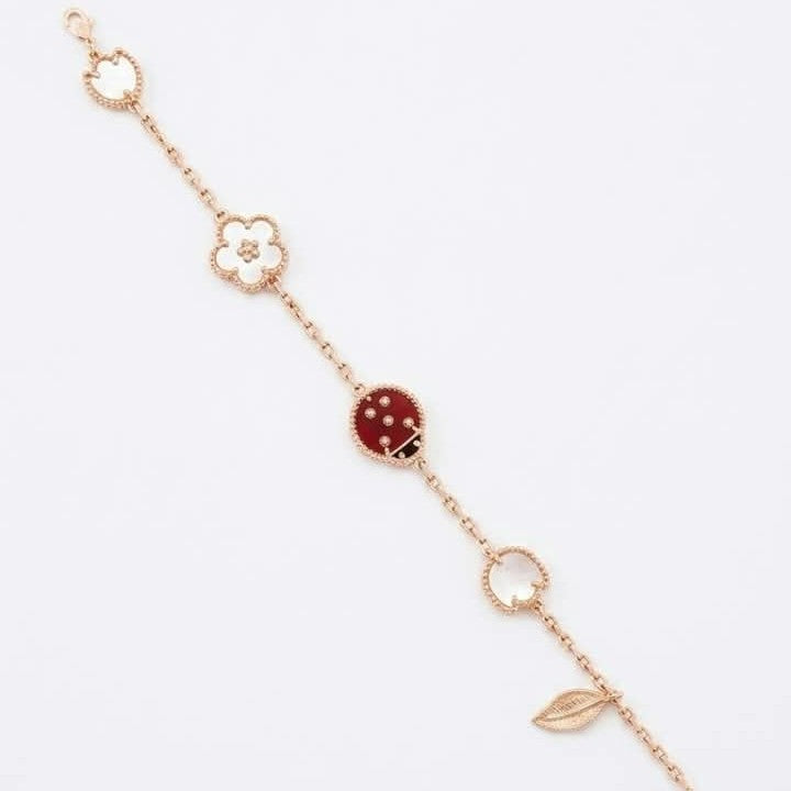 Van Cleef ladybug bracelet with a rose gold chain and carnelian and black onyx ladybug motif