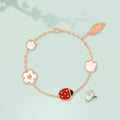 Van Cleef ladybug bracelet with a rose gold chain and carnelian and black onyx ladybug motif