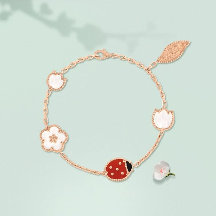 Van Cleef ladybug bracelet with a rose gold chain and carnelian and black onyx ladybug motif